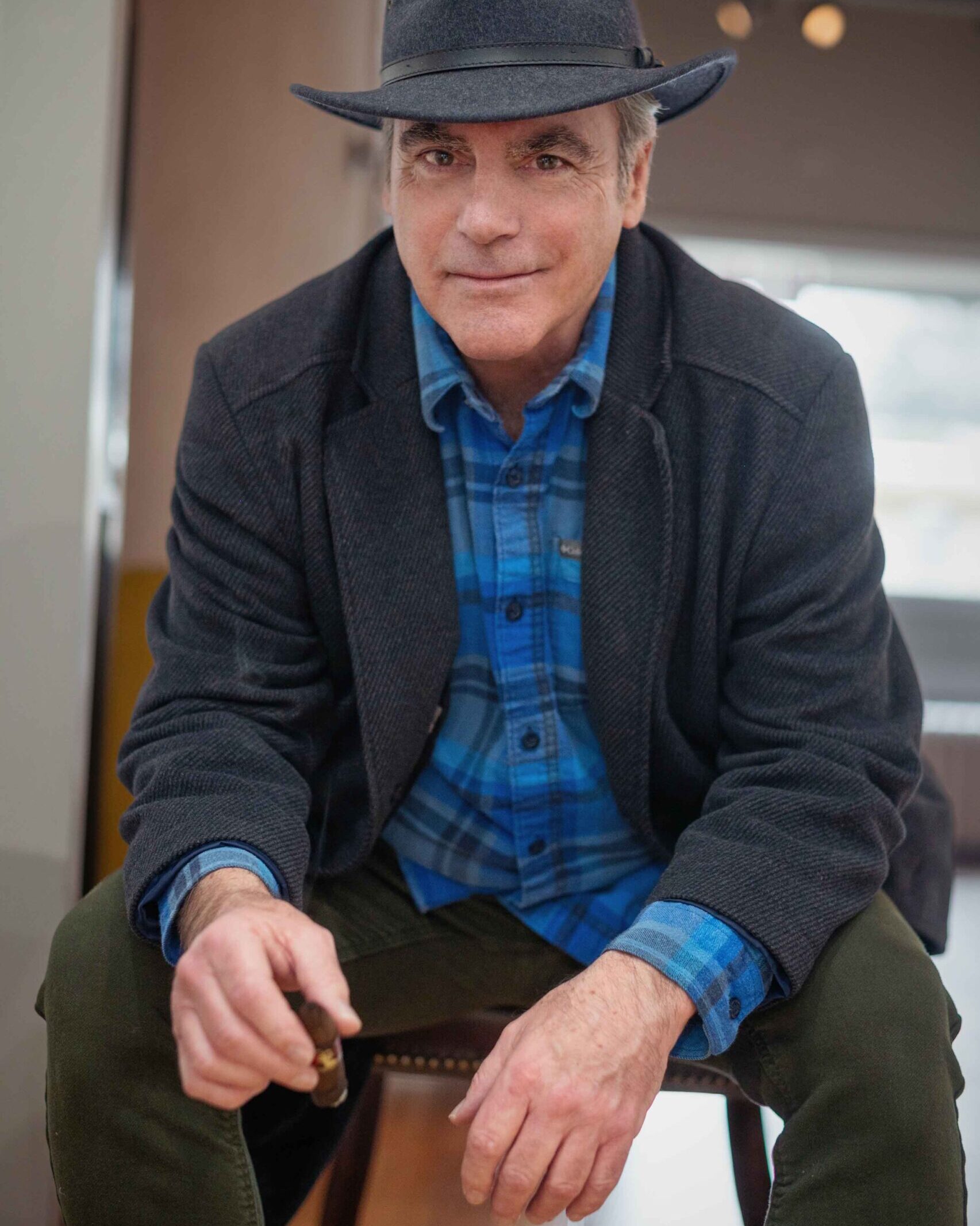 FENDRY-112-2 Headshot of mature man in plaid shirt and fedora, holding cigar, Racine WI studio